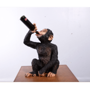 Drinkende aap met fleshouder